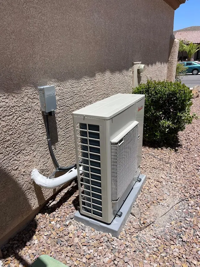 Residential air conditioning condenser unit in Becker